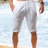 Short long en pur coton uni pour homme avec cordon de serrage et poches Short long en pur coton uni pour homme avec cordon de serrage et poches, short confortable et respirant pour la plage d'été et les loisirs de vacances août 16, 2024 Kotazando