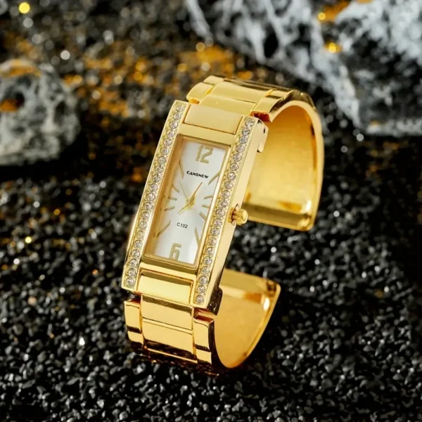 Montre bracelet à quartz de luxe TOOP dorée avec cadran en strass et heure mondiale pour femme Montre bracelet à quartz de luxe TOOP dorée avec cadran en strass et heure mondiale pour femme, Bracelet en alliage tendance 31 août 2024 Kotazando